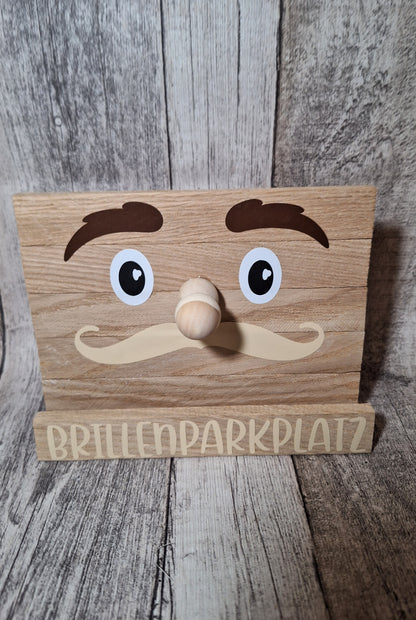 Niedlicher Holz-Brillenparkplatz mit Gesicht, ideal zur praktischen und dekorativen Aufbewahrung von Brillen.