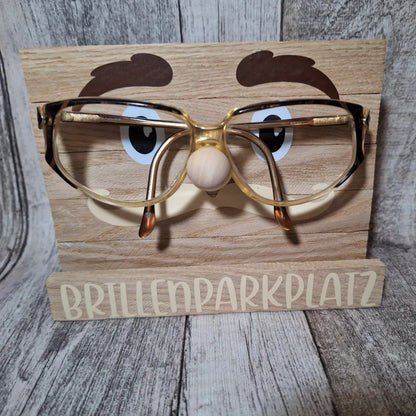 Niedlicher Holz-Brillenparkplatz mit Gesicht, ideal zur praktischen und dekorativen Aufbewahrung von Brillen.