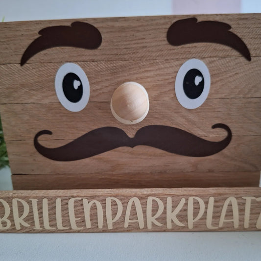 Niedlicher Holz-Brillenparkplatz mit Gesicht, ideal zur praktischen und dekorativen Aufbewahrung von Brillen.